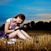girl writing on a field